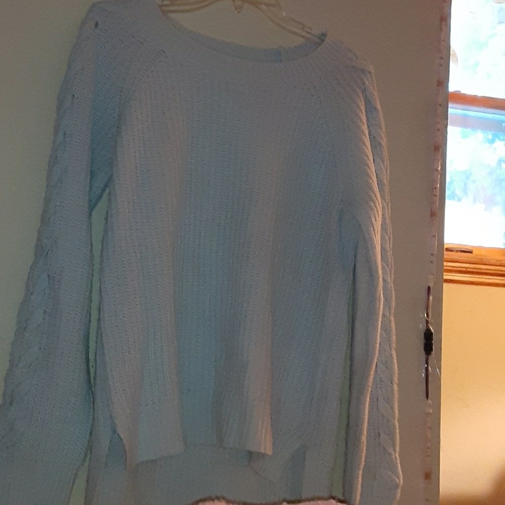 Sky blue sweater with braided sleeves